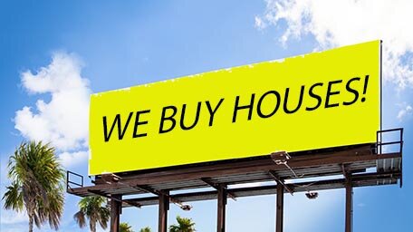 Billboard that says "We buy Houses"